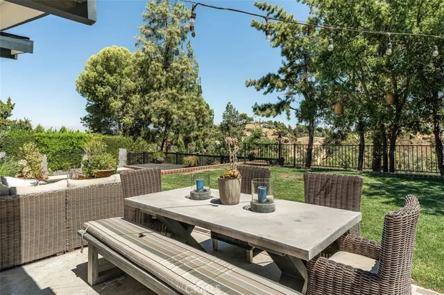 a view of a table and chairs in the patio