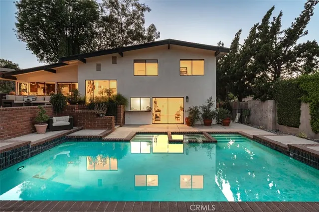 a view of a house with swimming pool