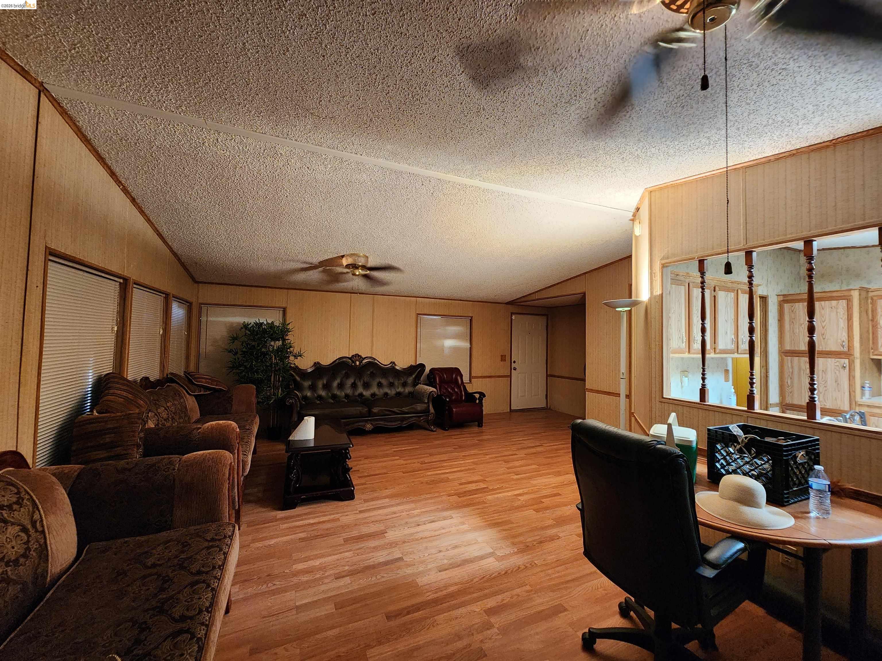 16612 Stagecoach Road Corning, CA 96021 - Photo 2 of 10 a living room with furniture window and wooden floor