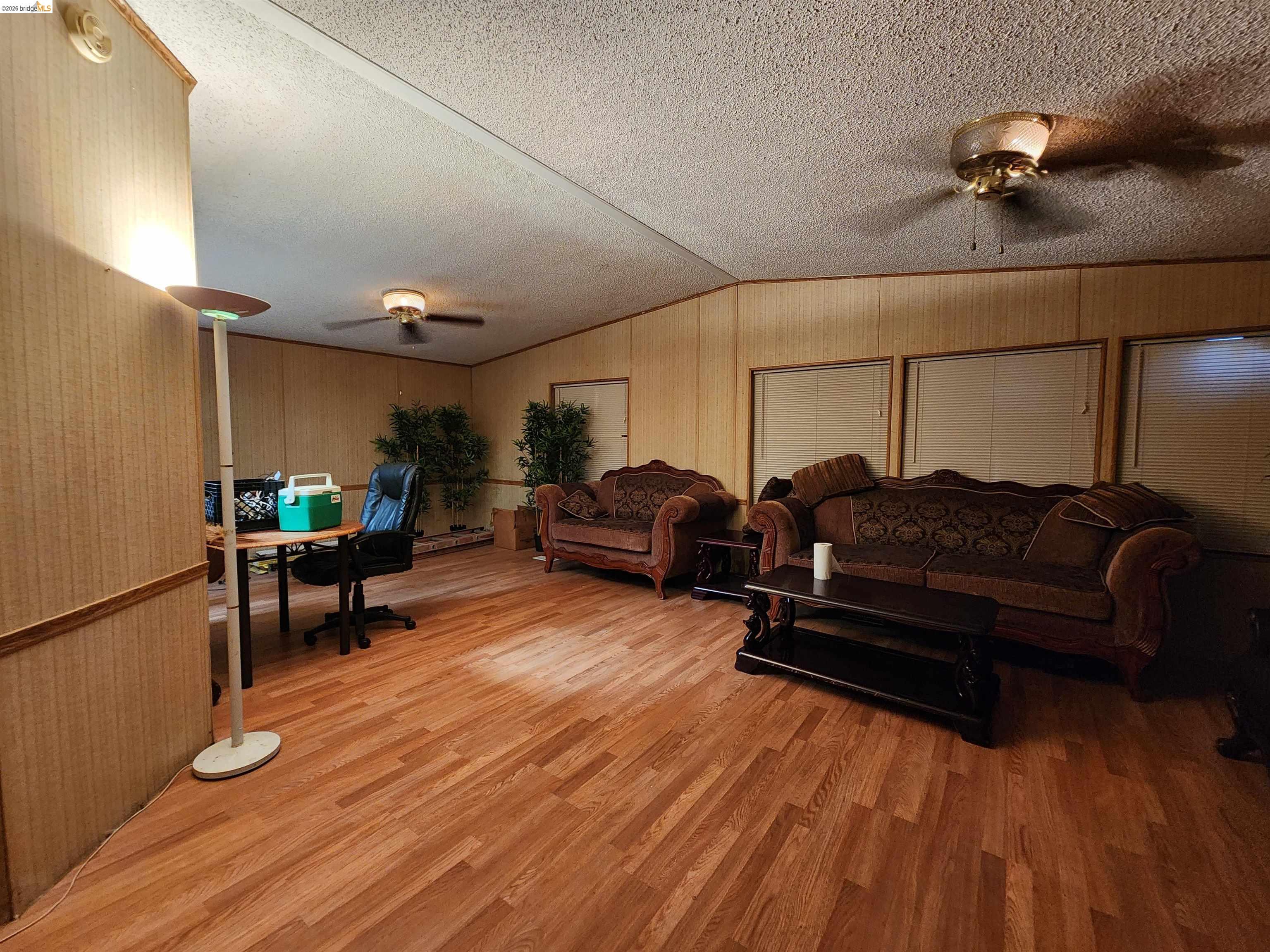 16612 Stagecoach Road Corning, CA 96021 - Photo 3 of 10 a living room with furniture and a wooden floor