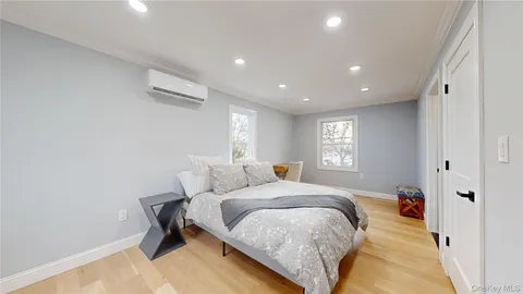 a bed room with a bed and a window