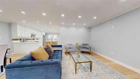 a living room with furniture kitchen view and kitchen view