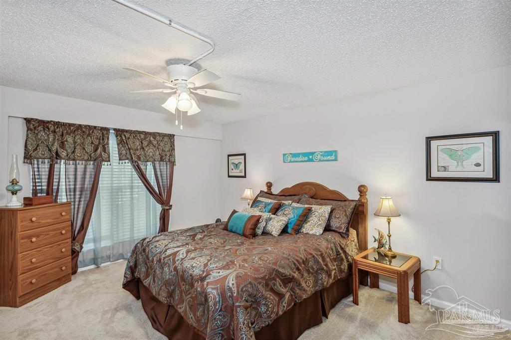 1261 Mahogany Mill Road Pensacola, FL 32507 - Photo 15 of 21 a bedroom with a bed and a dresser