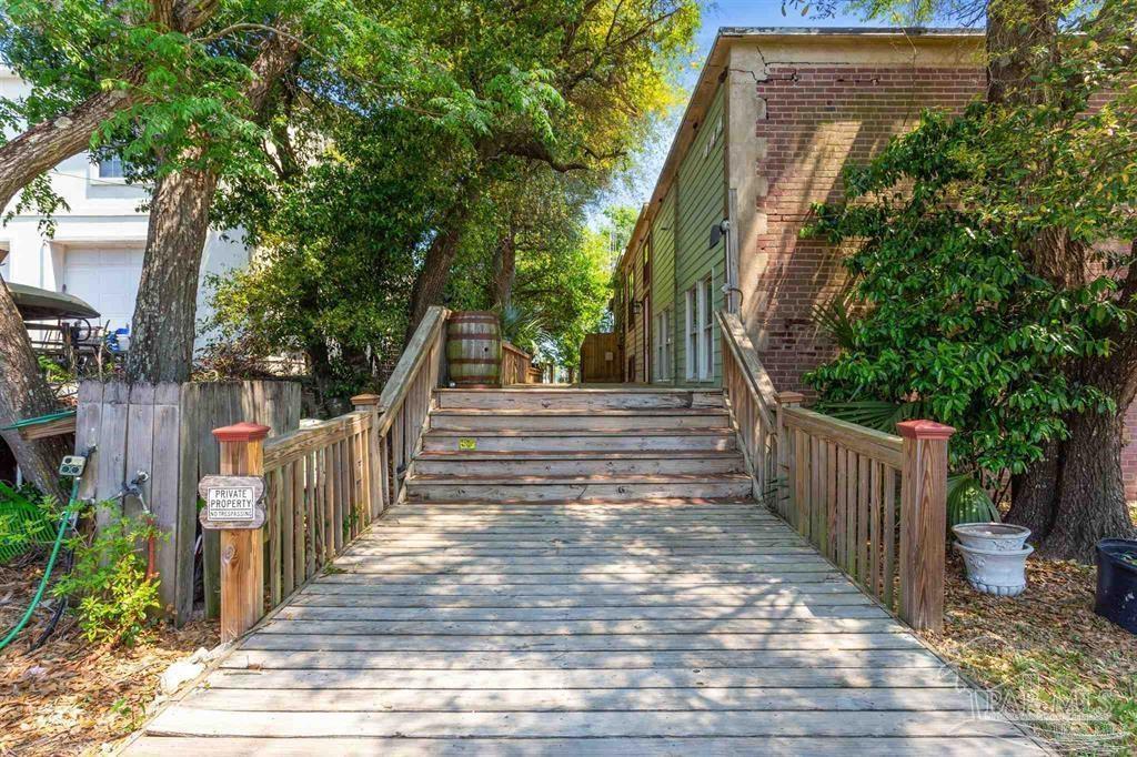 1261 Mahogany Mill Road Pensacola, FL 32507 - Photo 18 of 21 a view of stairs and yard with wooden fence