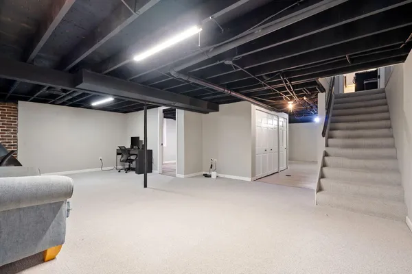 a view of an empty room with a couch