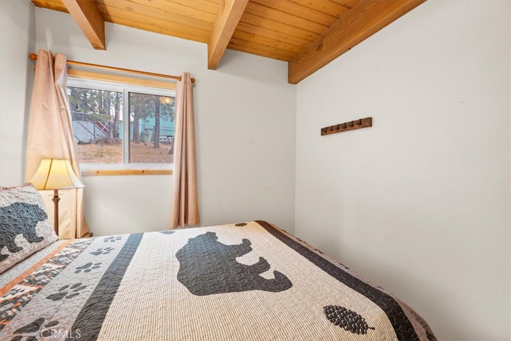 567 Highland Road Big Bear Lake, CA 92315 - Photo 16 of 42 a bedroom with a bed and a window