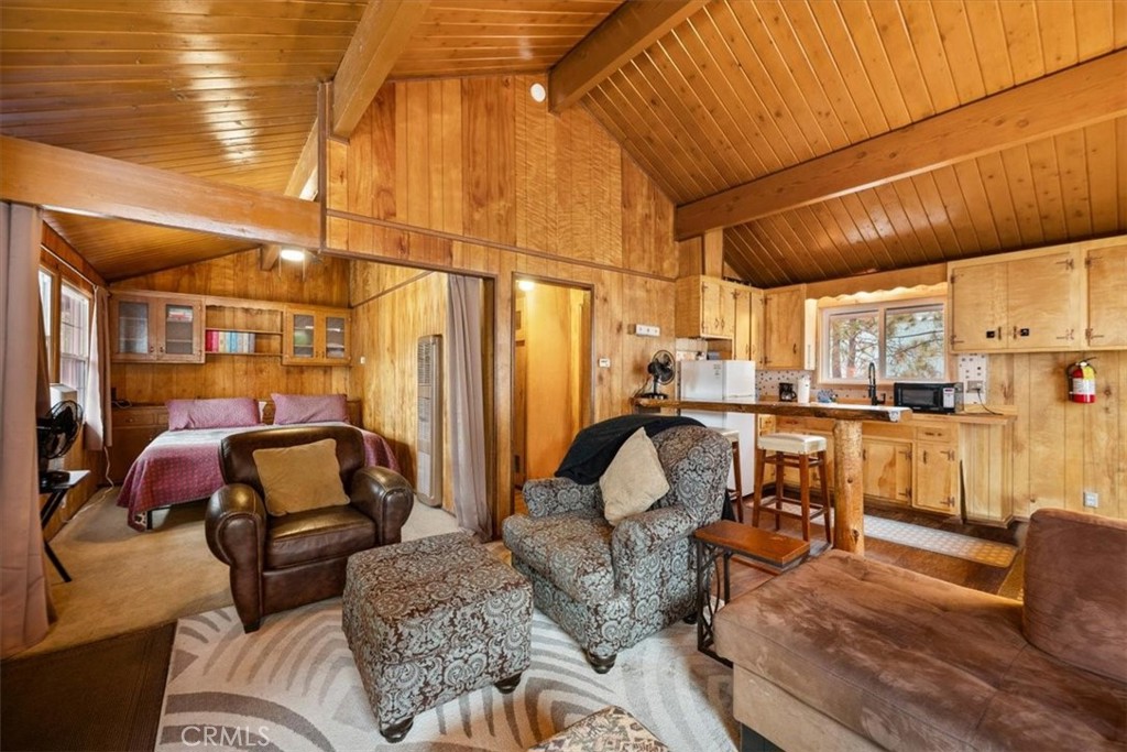 567 Highland Road Big Bear Lake, CA 92315 - Photo 26 of 42 a living room with furniture and a couch