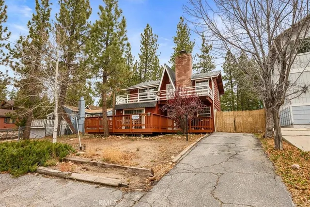 a view of balcony with wooden floor and fence