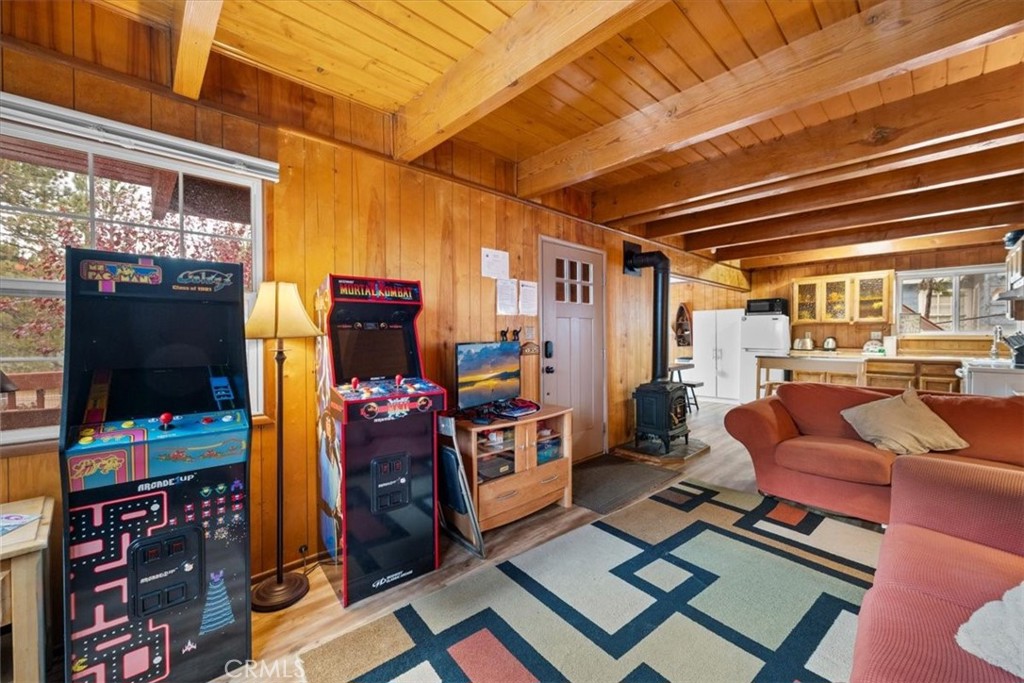 567 Highland Road Big Bear Lake, CA 92315 - Photo 10 of 42 a living room with furniture and a flat screen tv