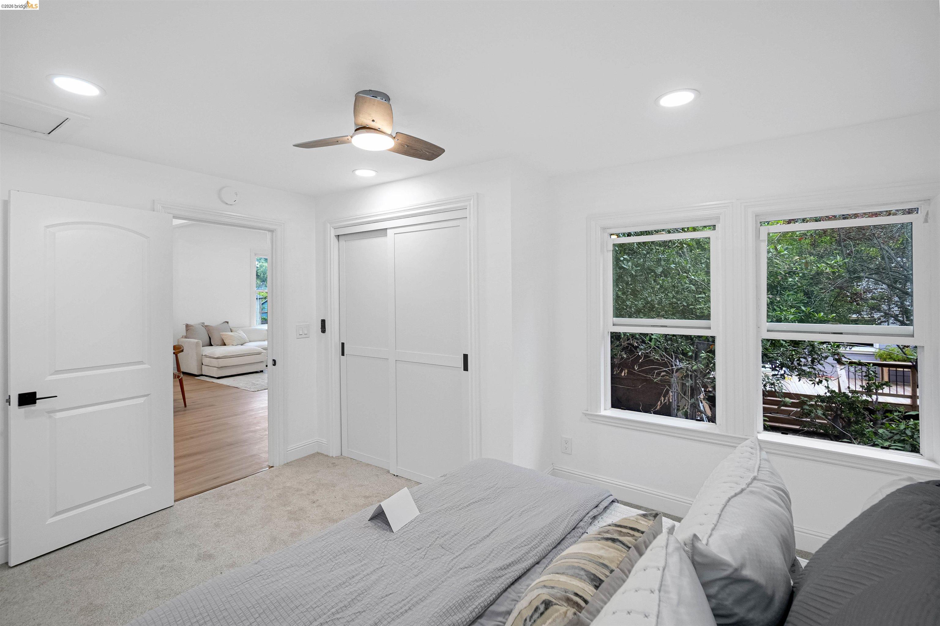 1812 Woolsey Street Berkeley, CA 94703 - Photo 19 of 48 Room featuring white walls, recessed lighting, and a ceiling fan with integrated illumination