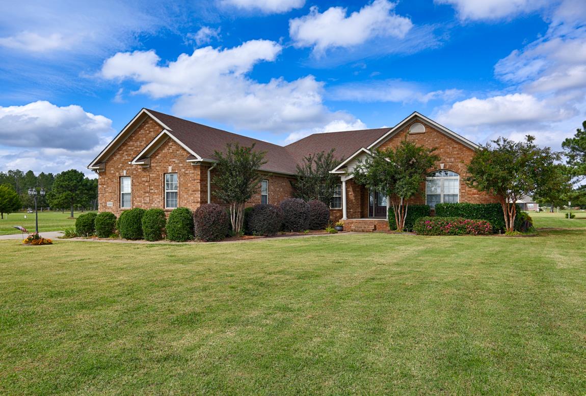 24811 Drawbaugh Road Athens, AL 35613 - Photo 1 of 30 Front View of Home - Custom built home on Southern Gayles Golf Course, with immaculate landscaping surrounding the home. Includes a lot on each side of the home for a total of 1.26 acres and added privacy.