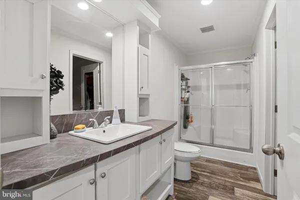 a view of walk in closet with clothes