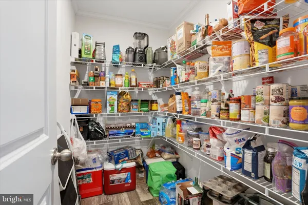 a bedroom with a bed and a ceiling fan