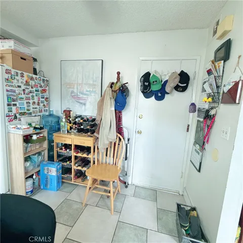 a view of a dining room with furniture and a garage