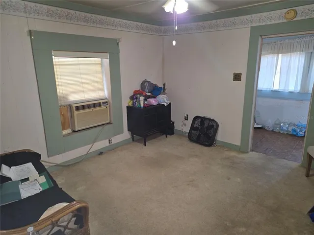 a bed room with a bed and a window