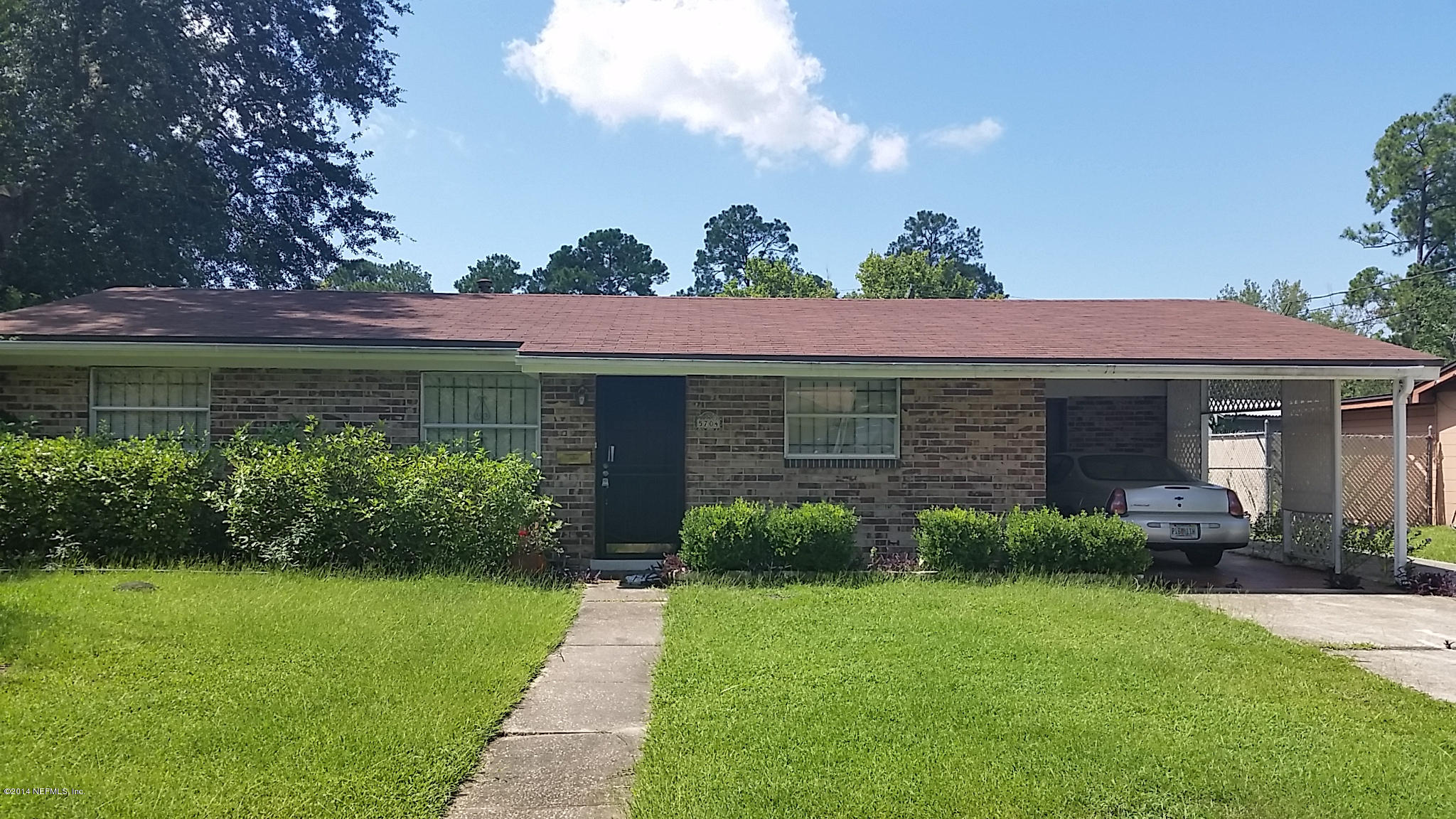 5704 Sabena Road Jacksonville, FL 32207 - Photo 1 of 3 a view of a house with garden and plants