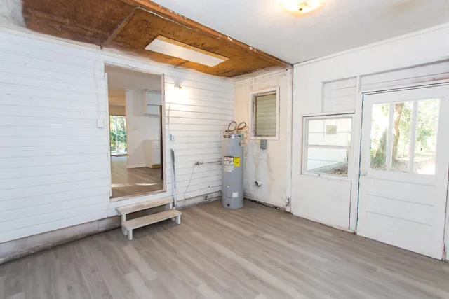 a view of an empty room and wooden floor
