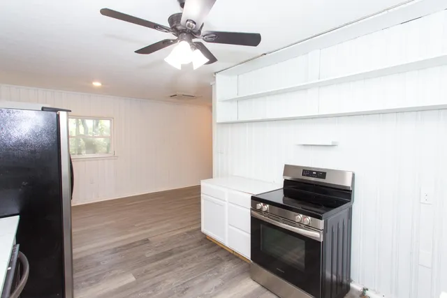a kitchen with a stove and a microwave