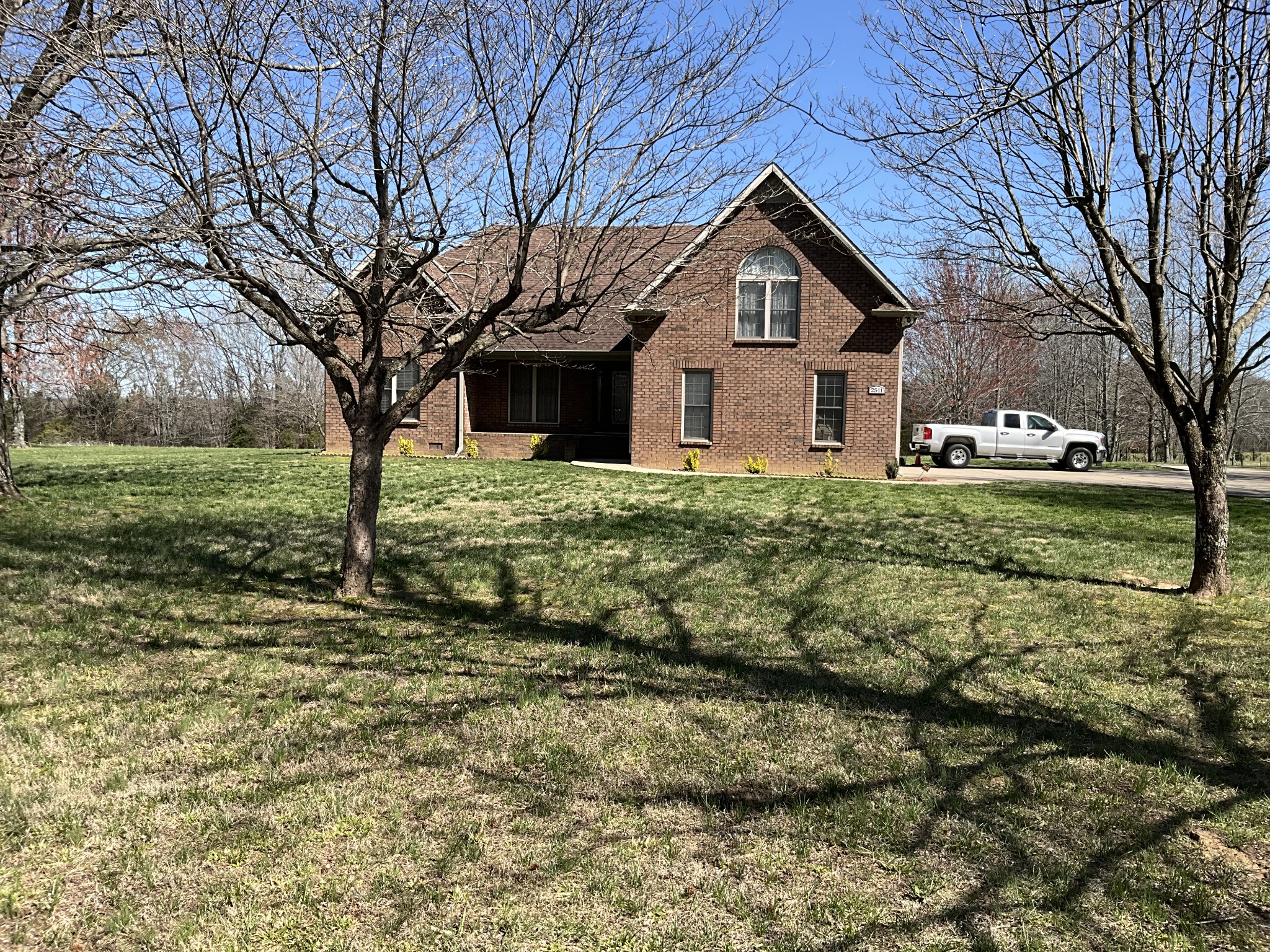 a front view of a house with a yard