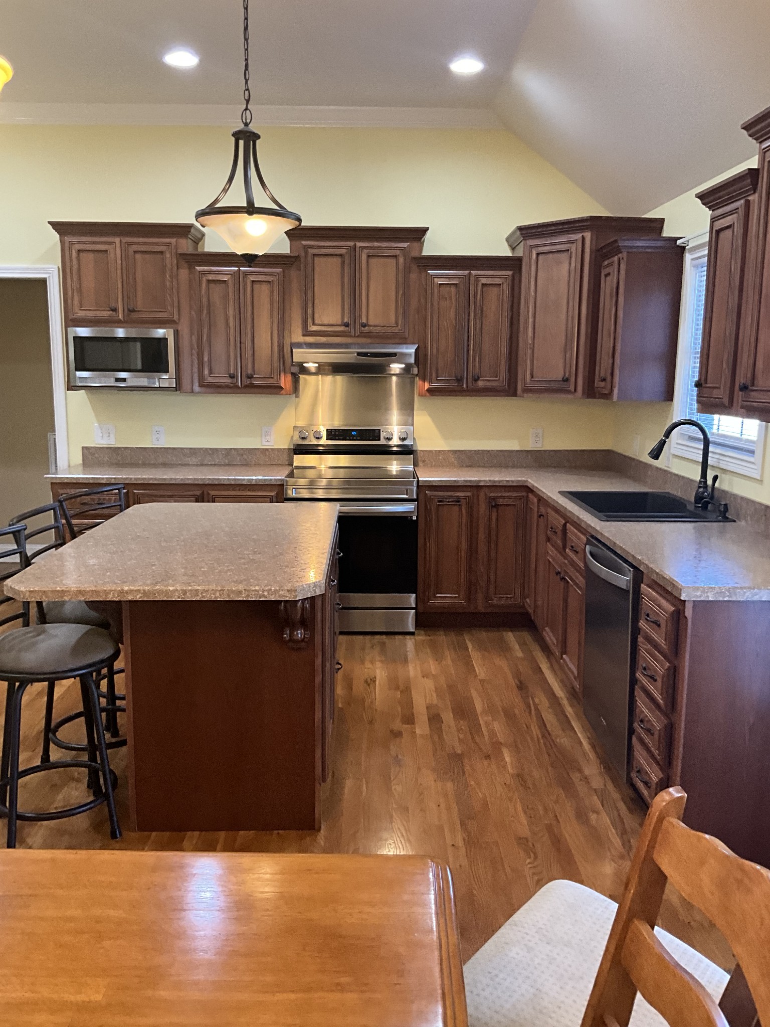 2511 Chambliss Road Pleasant View, TN 37146 - Photo 5 of 24 a kitchen with stainless steel appliances granite countertop a stove a sink dishwasher and cabinets with wooden floor
