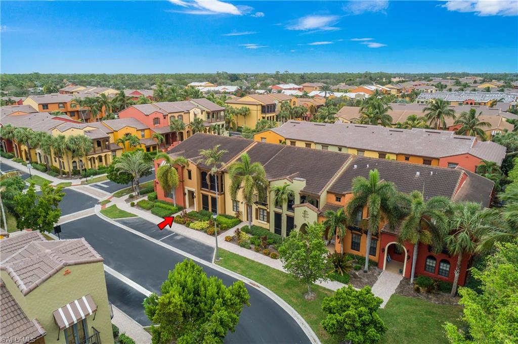 9108 Capistrano Street South, Unit 7402 Naples, FL 34113 - Photo 19 of 50 an aerial view of residential houses with outdoor space and street view