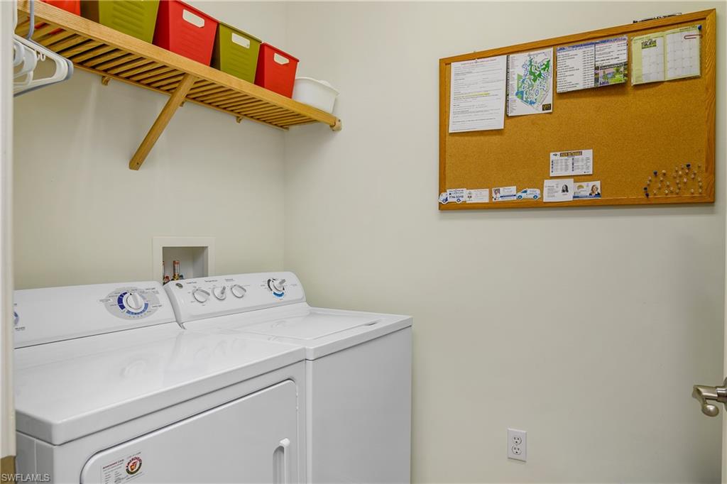 9108 Capistrano Street South, Unit 7402 Naples, FL 34113 - Photo 30 of 50 a utility room with dryer and washer