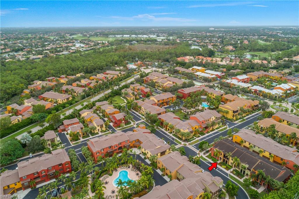 9108 Capistrano Street South, Unit 7402 Naples, FL 34113 - Photo 35 of 50 an aerial view of city and lake