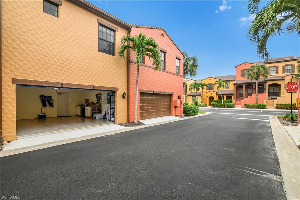 9108 Capistrano Street South, Unit 7402 Naples, FL 34113 - Photo 36 of 50 a view of street with large building