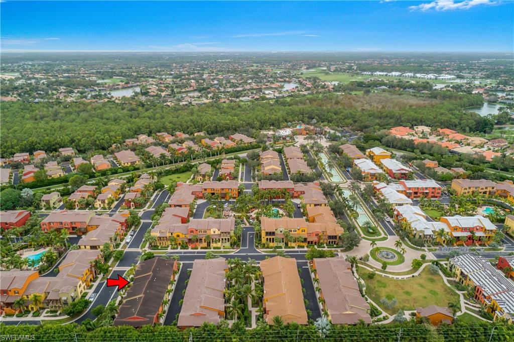 9108 Capistrano Street South, Unit 7402 Naples, FL 34113 - Photo 37 of 50 an aerial view of residential building with outdoor space