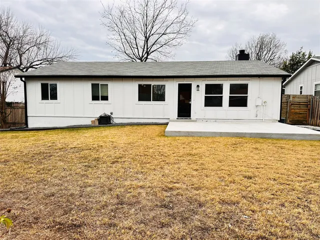 a house view with swimming pool in front of it