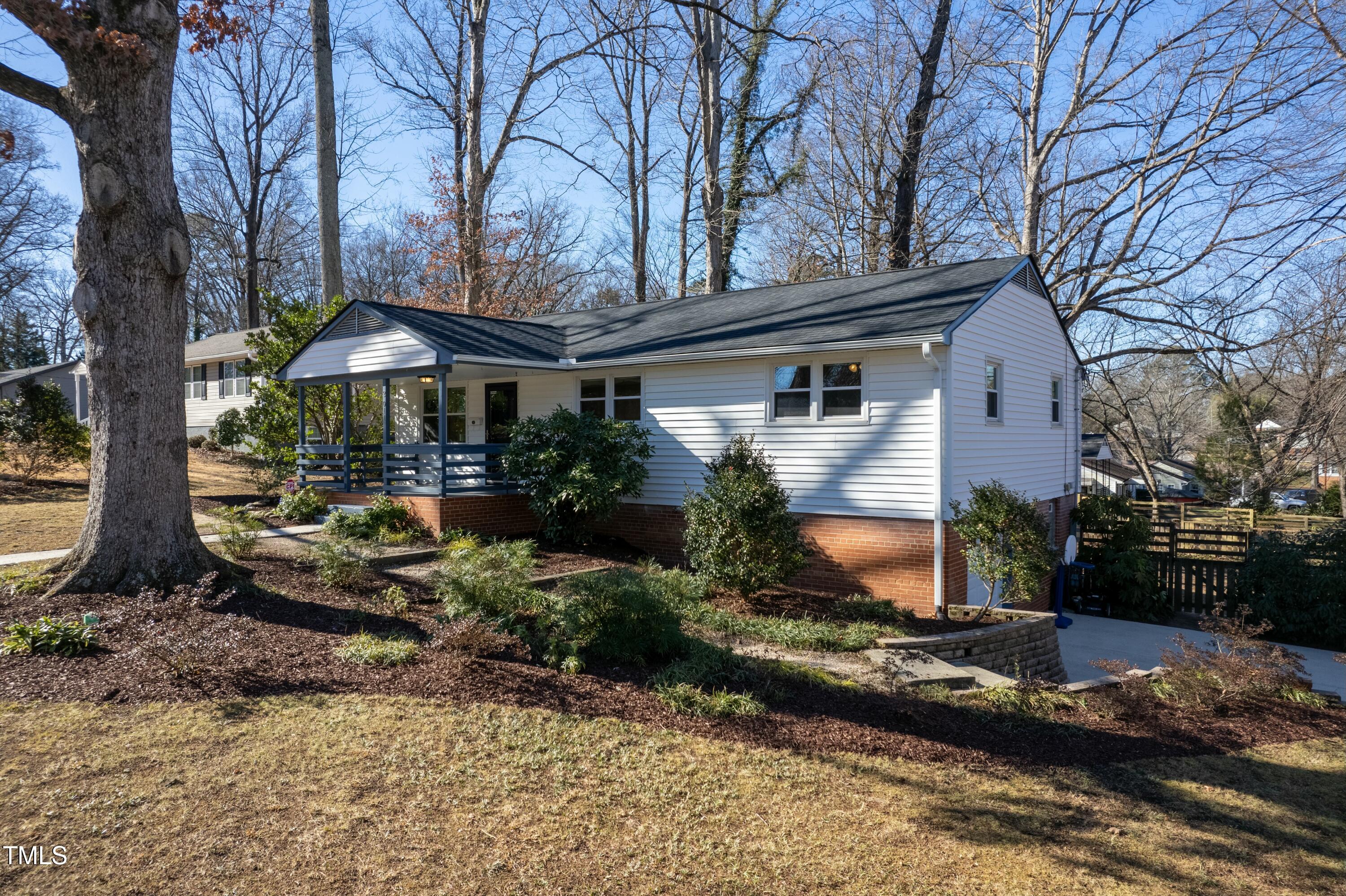 2011 Watkins Street Raleigh, NC 27604 - Photo 27 of 36 a view of a house with backyard and trees