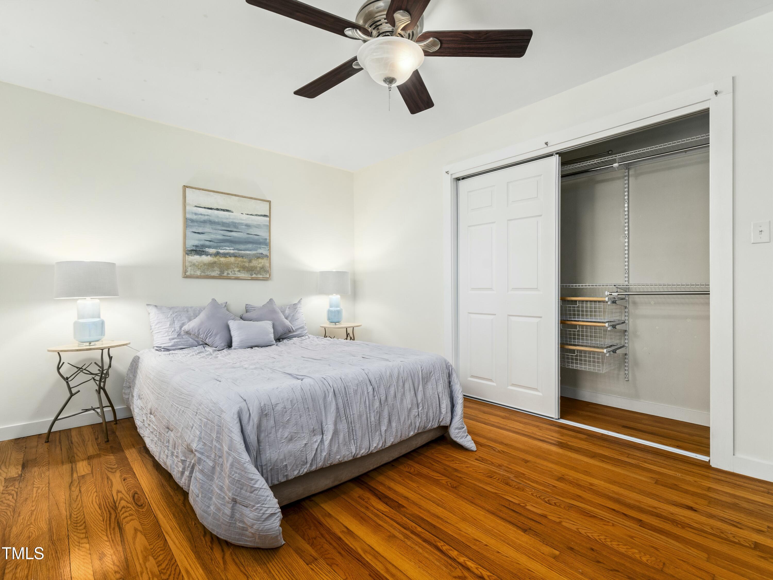 2011 Watkins Street Raleigh, NC 27604 - Photo 33 of 36 a bedroom with a bed and wooden floor