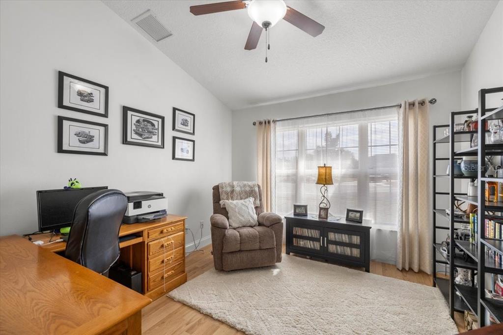 9957 Southwest 55th Ave Road Ocala, FL 34476 - Photo 19 of 41 a living room with furniture and a window