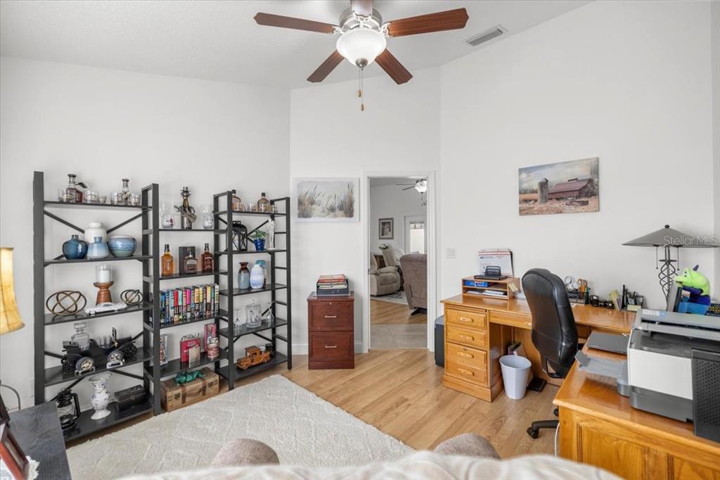 9957 Southwest 55th Ave Road Ocala, FL 34476 - Photo 20 of 41 a view of a workspace with furniture and a ceiling fan