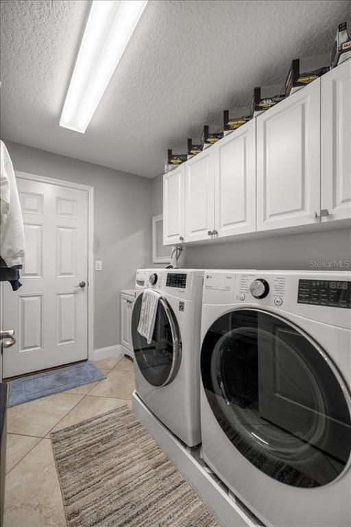 9957 Southwest 55th Ave Road Ocala, FL 34476 - Photo 26 of 41 a utility room with sink dryer and washer