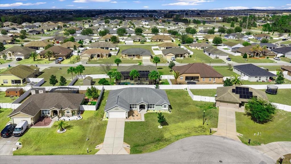 9957 Southwest 55th Ave Road Ocala, FL 34476 - Photo 33 of 41 an aerial view of residential houses with outdoor space