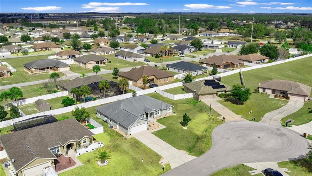 9957 Southwest 55th Ave Road Ocala, FL 34476 - Photo 34 of 41 an aerial view of residential houses with outdoor space