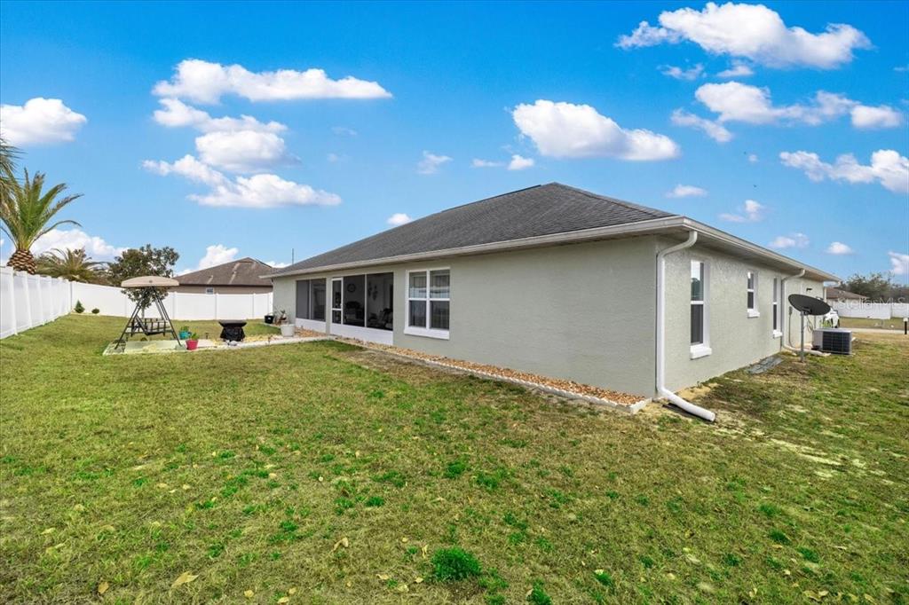 9957 Southwest 55th Ave Road Ocala, FL 34476 - Photo 38 of 41 a view of a house with a backyard