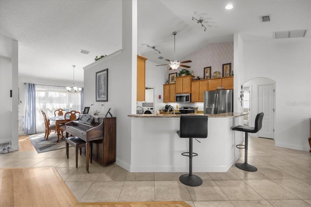 9957 Southwest 55th Ave Road Ocala, FL 34476 - Photo 6 of 41 a view of a kitchen and dining room