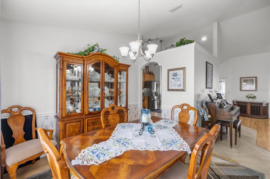 9957 Southwest 55th Ave Road Ocala, FL 34476 - Photo 8 of 41 a view of a dining room with furniture