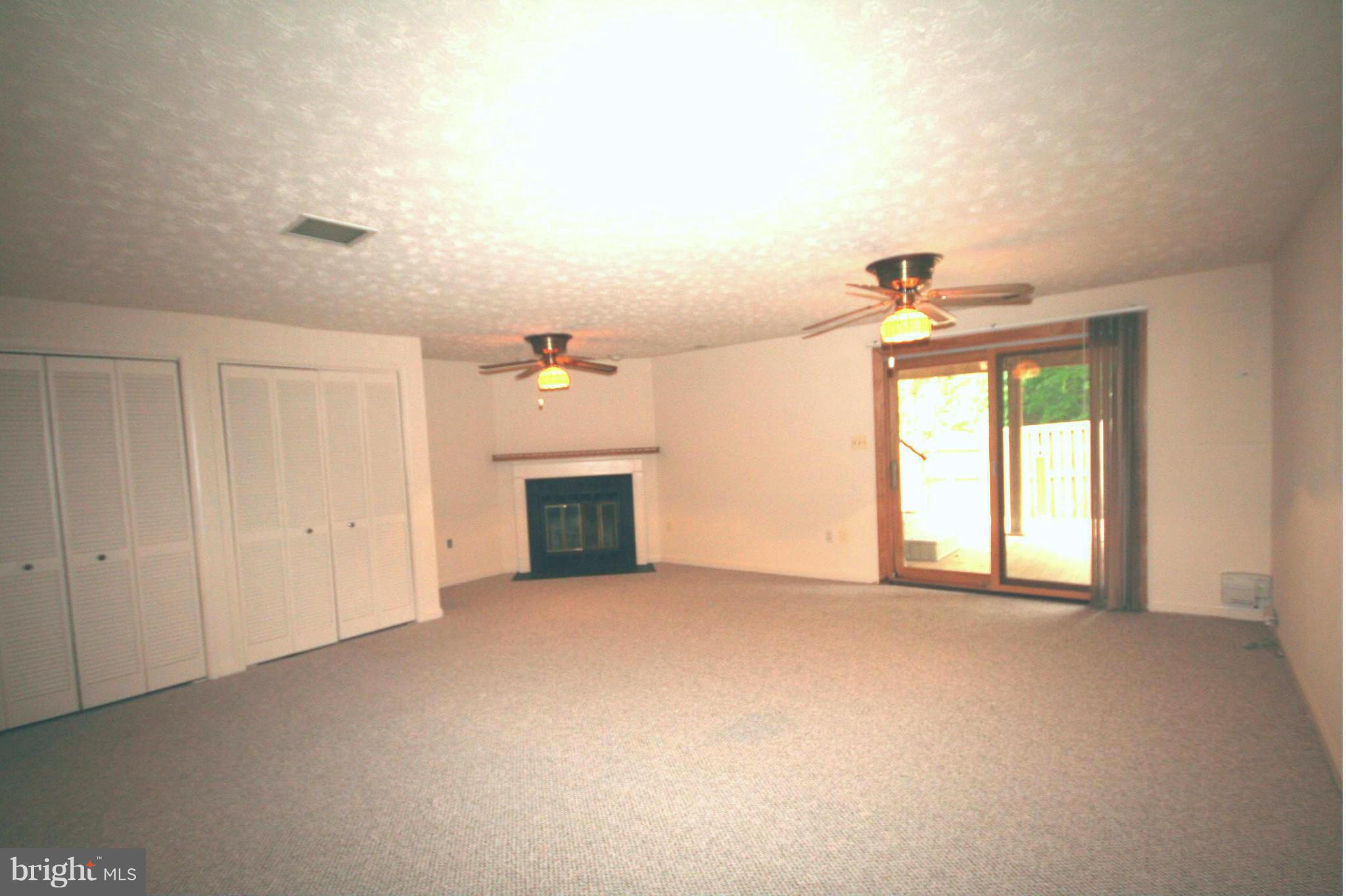 7467 Ridge Oak Court Springfield, VA 22153 - Photo 16 of 24 Huge rec room on lower level has gas fireplace