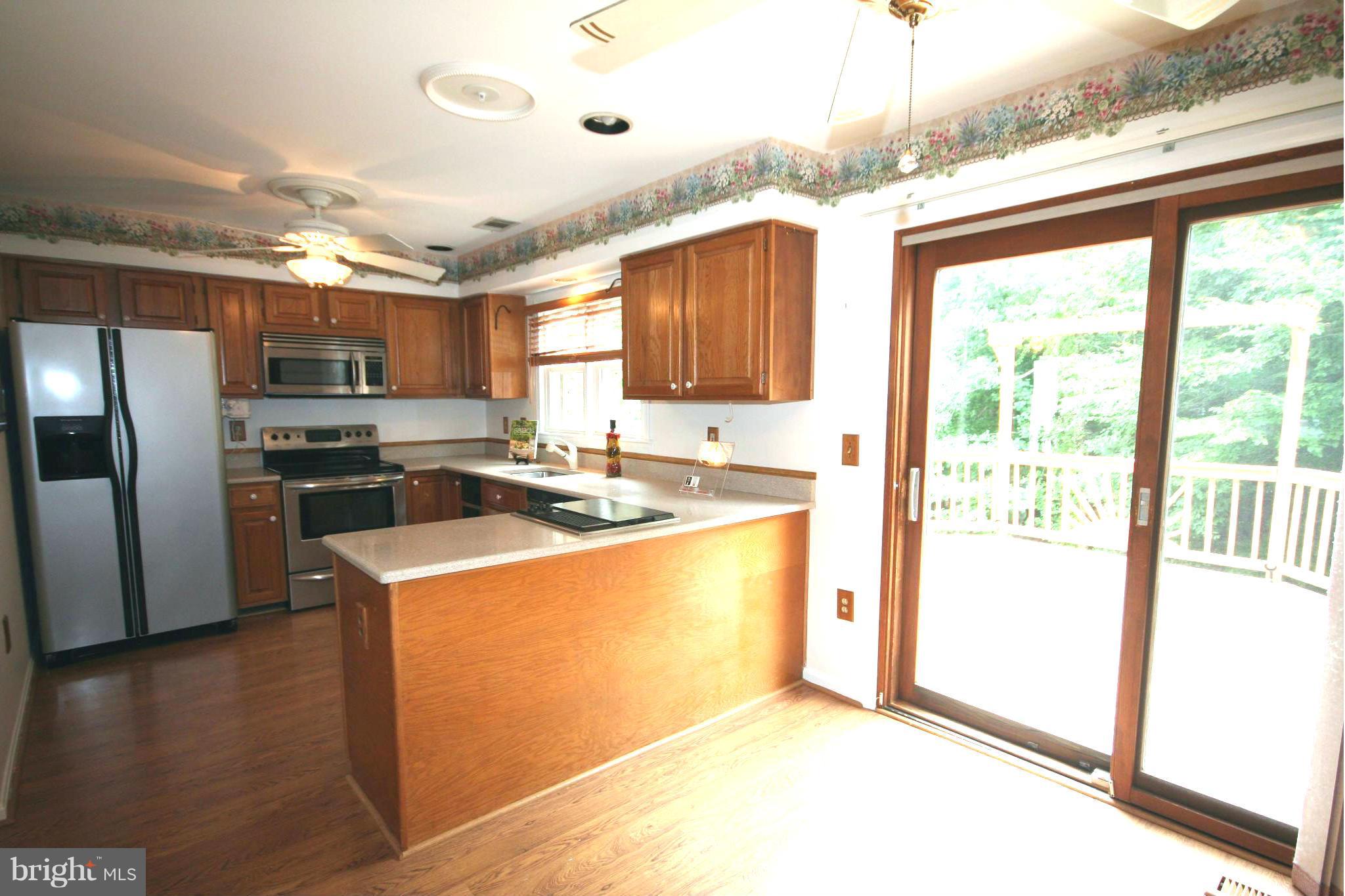 7467 Ridge Oak Court Springfield, VA 22153 - Photo 7 of 24 Kitchen has access to large deck
