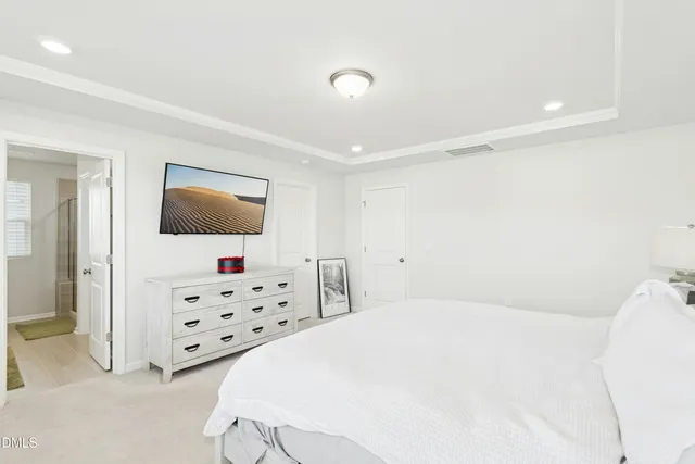 a kitchen with stainless steel appliances kitchen island granite countertop a refrigerator a stove a sink dishwasher with a dining table and chairs