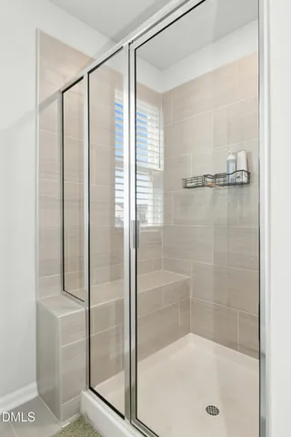 a bathroom with 2 sink and a mirror