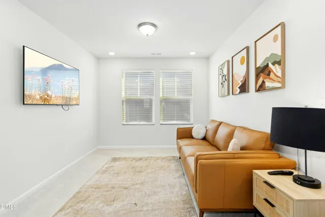 a blue couch sitting next to a white walls