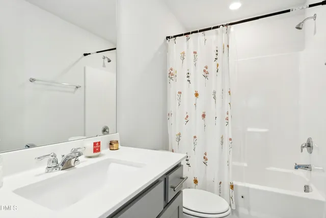 a bedroom with furniture and windows