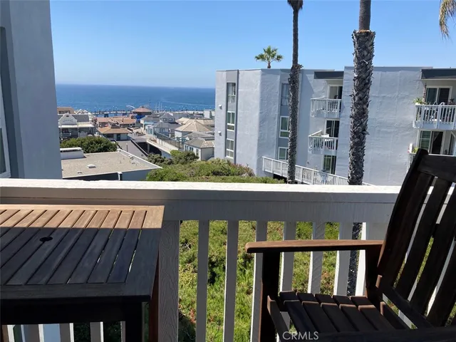 a view of a balcony with city view