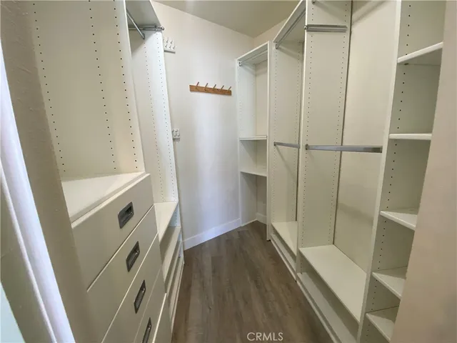a bathroom with a glass door shower and a sink