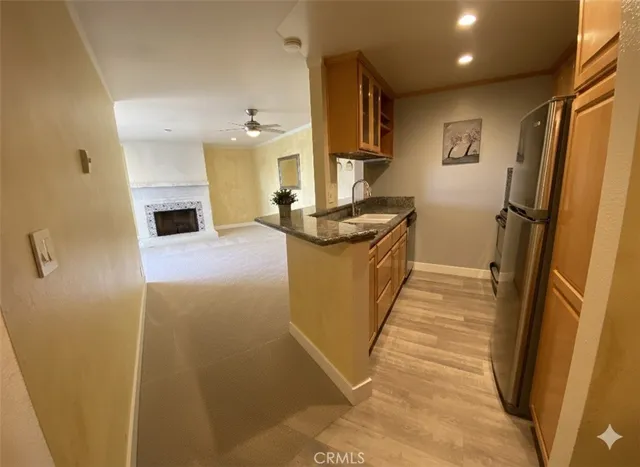 a view of a kitchen from the hallway