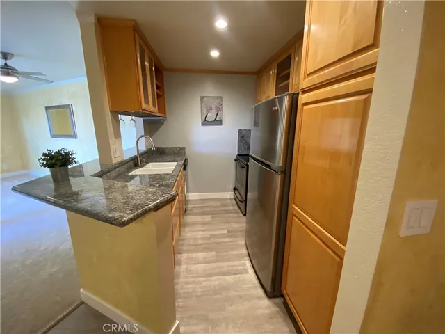 a kitchen with a sink and refrigerator